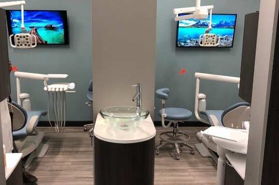Two adjacent dental treatment rooms