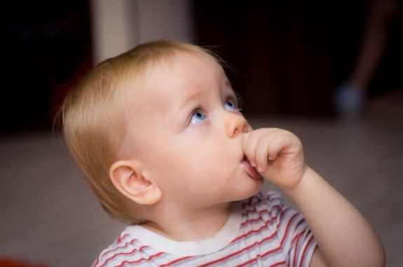 Baby sucking their thumb