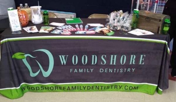 Table with various toothbrushes and dental products