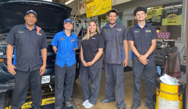 Dental team members at auto shop