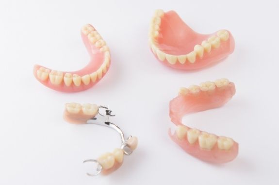 Two partial dentures and two full dentures in Clute
