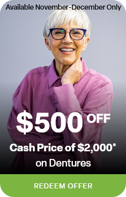 Woman in leather jacket leaning against brick wall