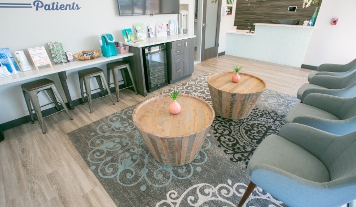 Two small tables in dental office waiting room