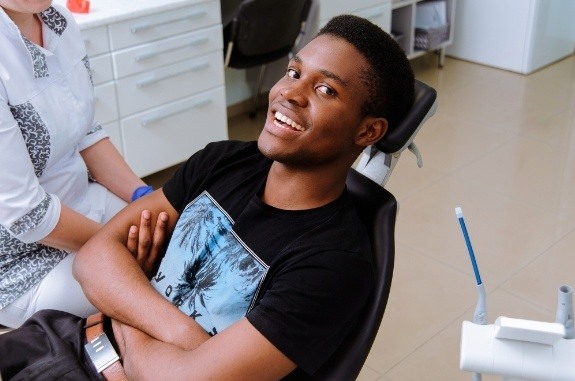 Man sitting in dental chair before oral cancer screening in Clute