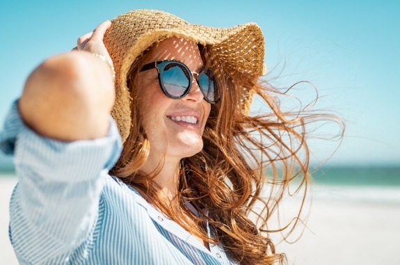 Woman wearing sunhat on beach