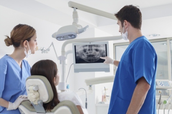 Dentist showing a patient their dental x rays