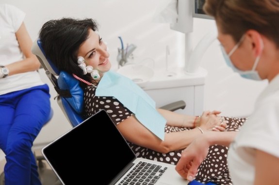 Woman in dental chair receiving test for T M J disorder