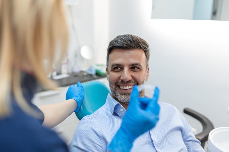 Man smiling after fluoride treatments